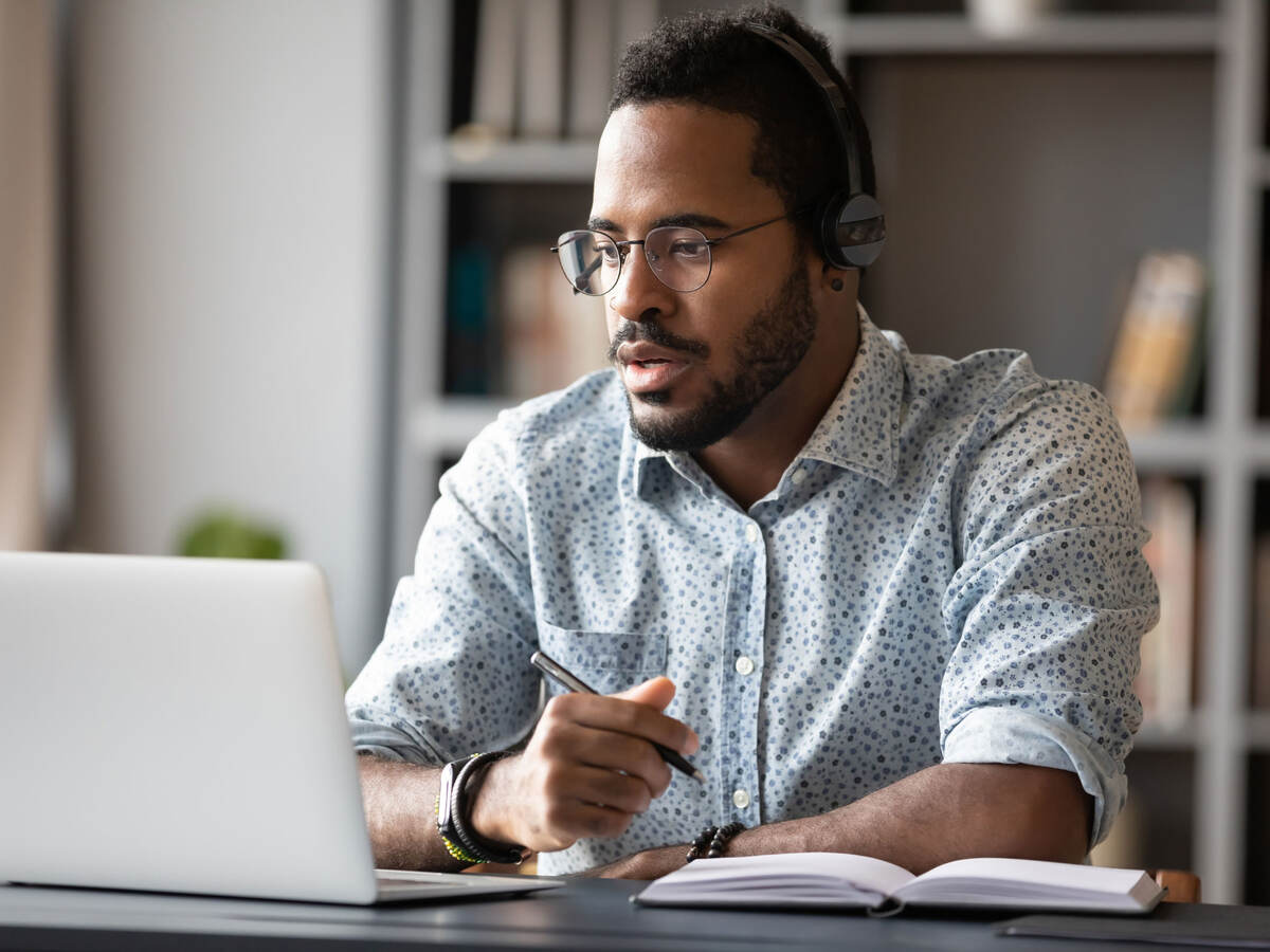 Focused business person watching webinar