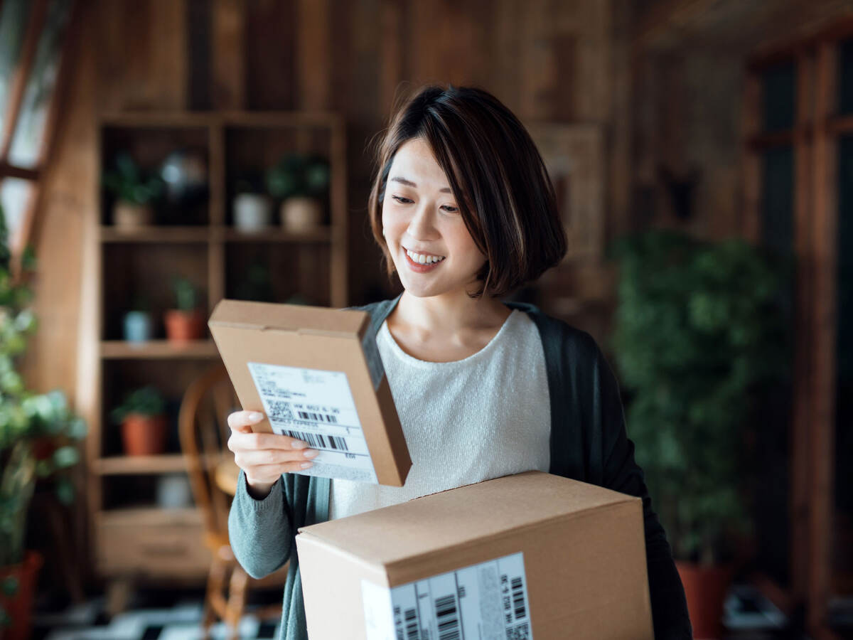 Woman holding two packages