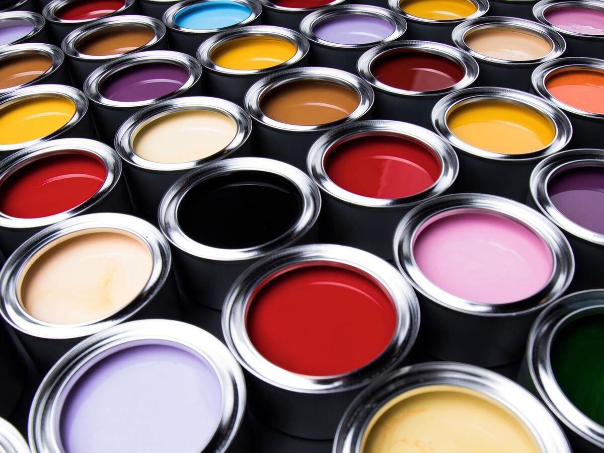 Several full cans of paint