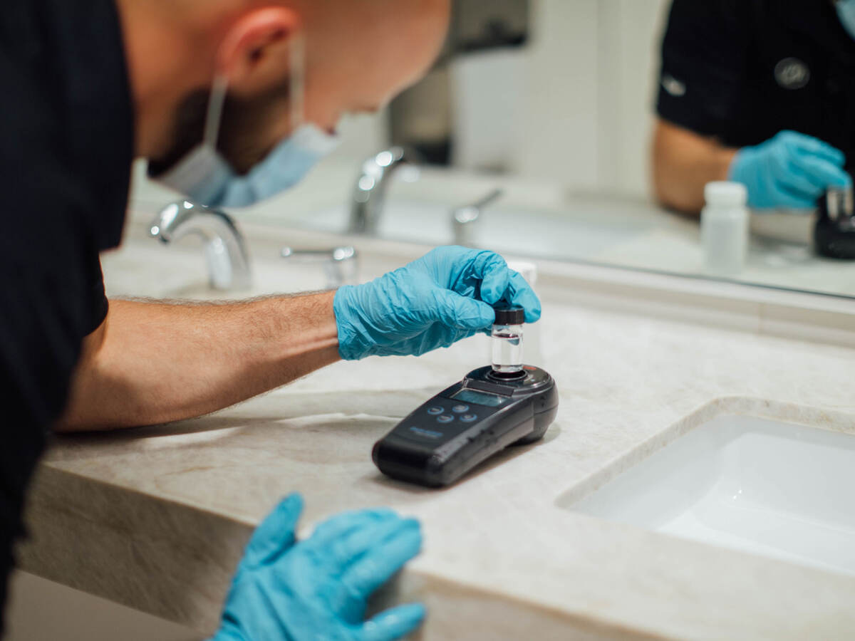 A person testing air and water quality