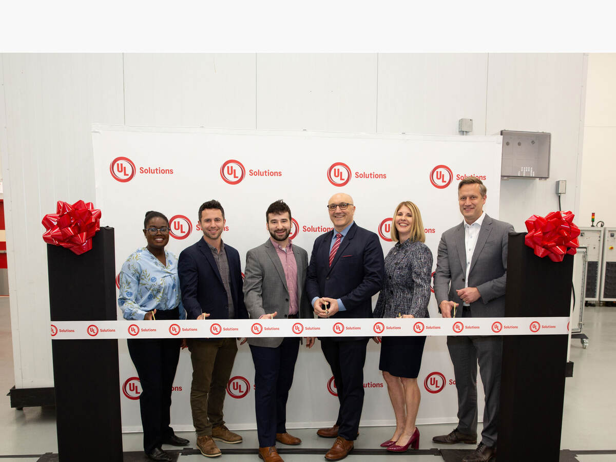 UL Solutions team cutting a ribbon