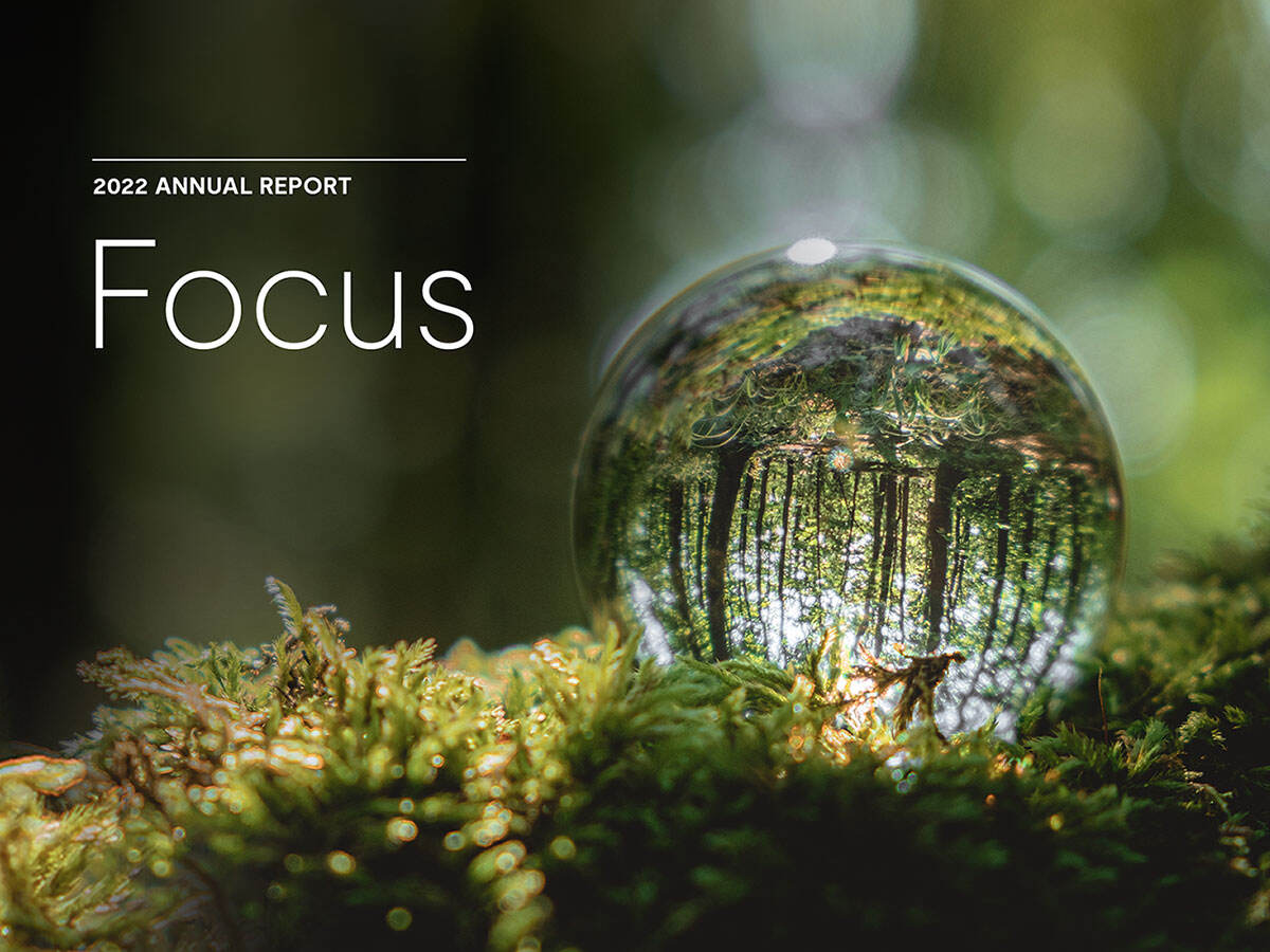 2022 Annual Report - Focus with a closeup view of a water drop in the woods