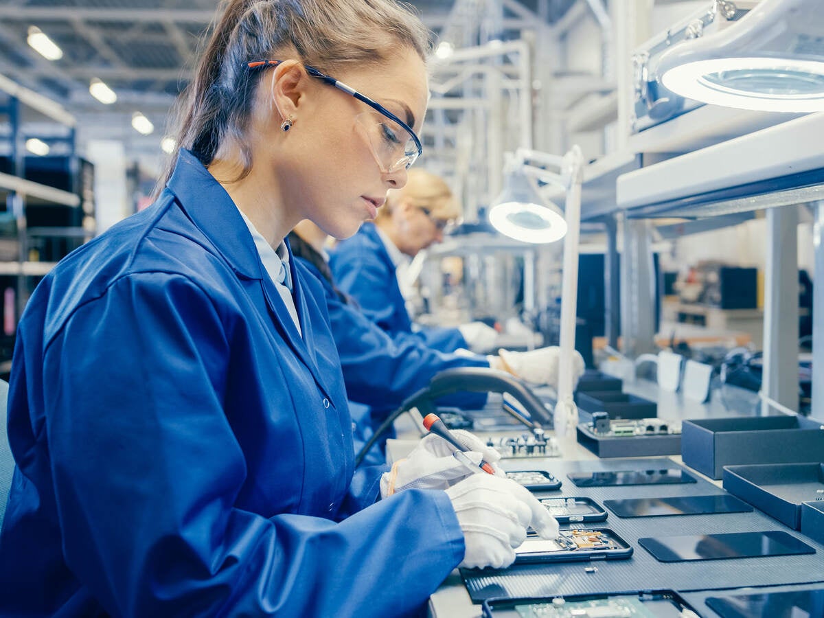 A person working in an electronics factory