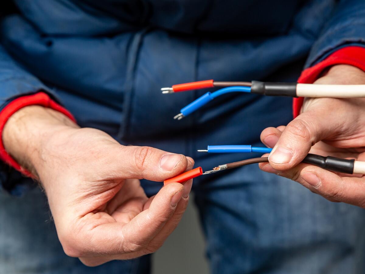 Putting insulation on wires.