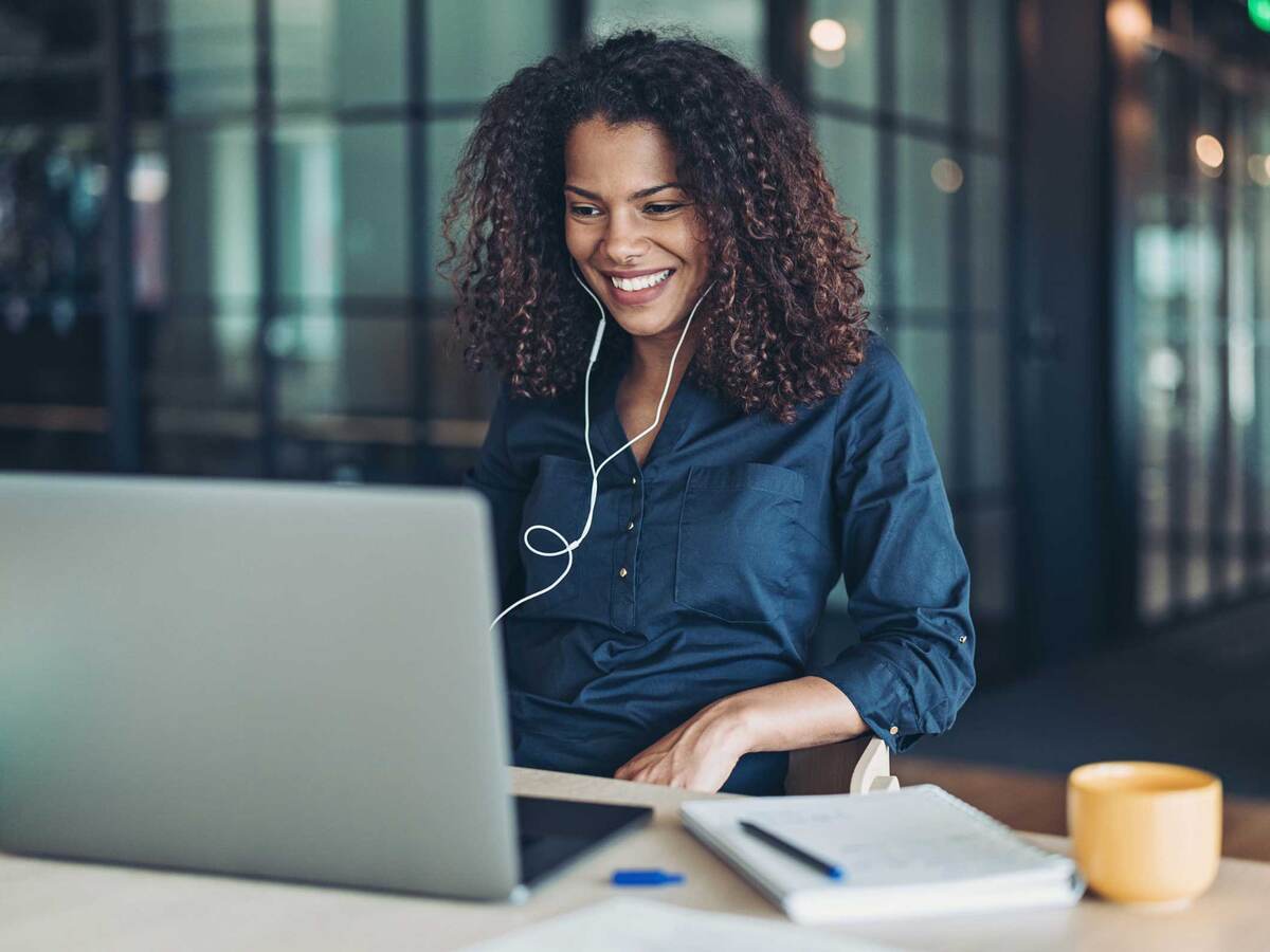 Person smiling while having an online meeting