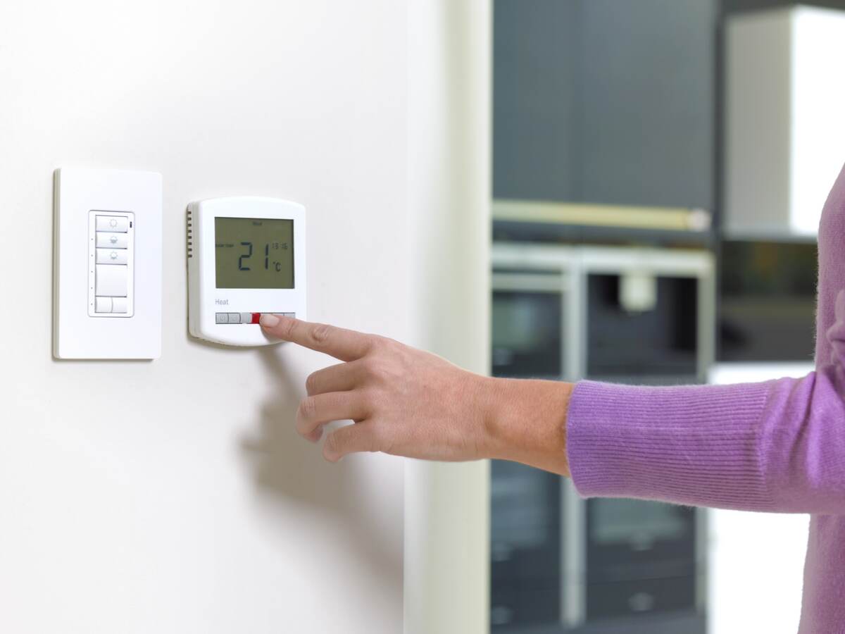 Woman changing heating.