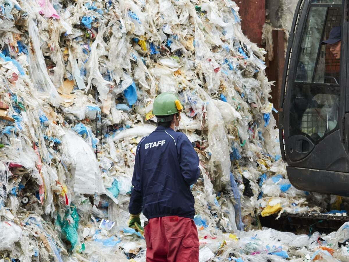 Workers at an industrial waste treatment facility.