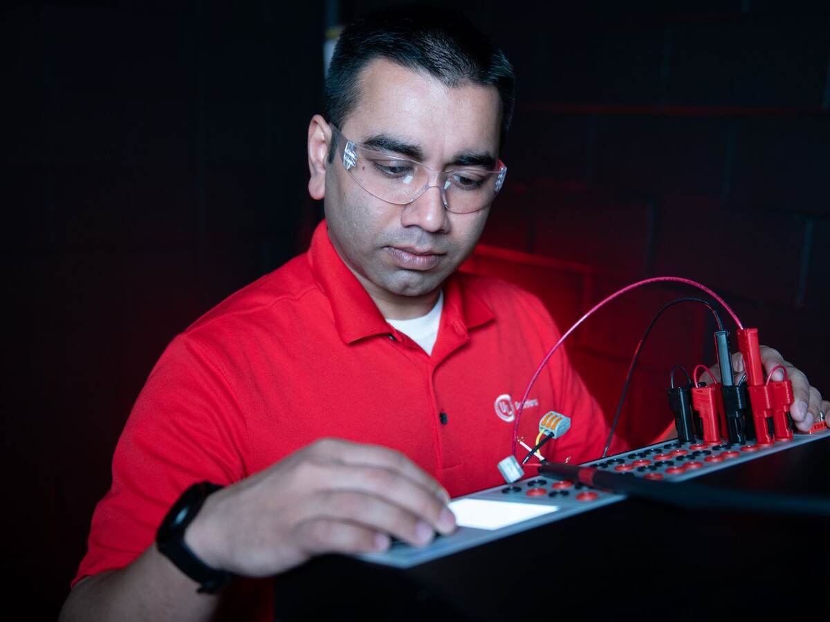 UL Solutions engineer preparing for a photometry test in the laboratory.