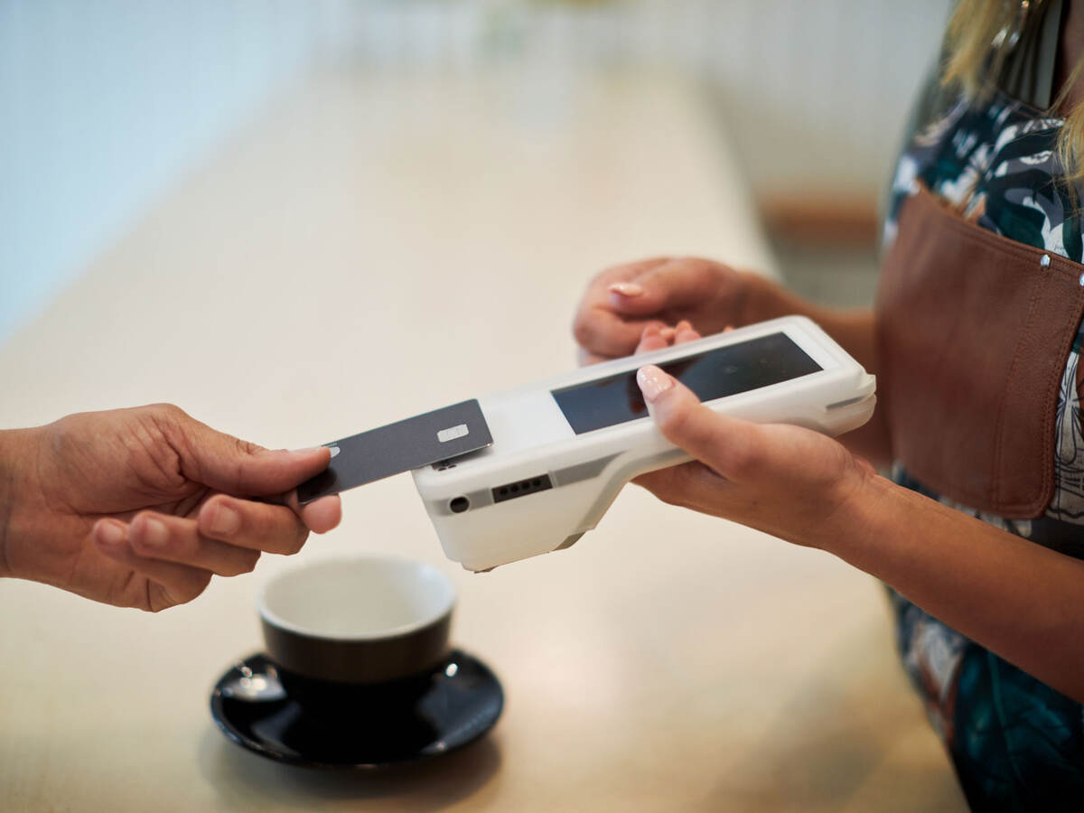 two people performing a contactless payment transaction