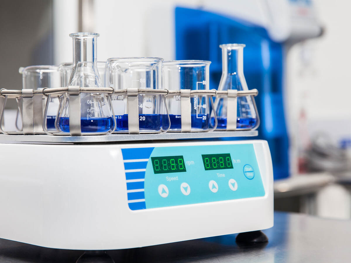 Close-Up Of Beakers On Weight Scale In Laboratory