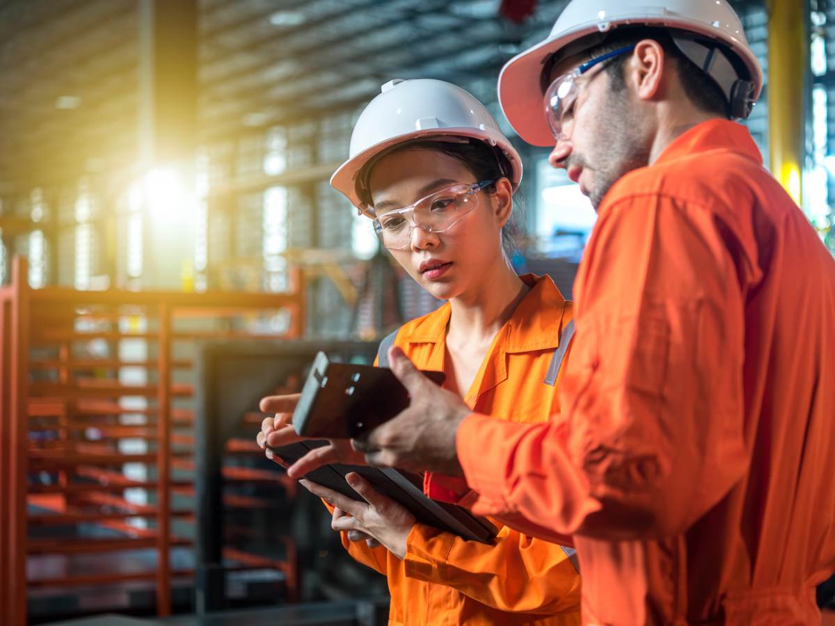 Engineers examining a product