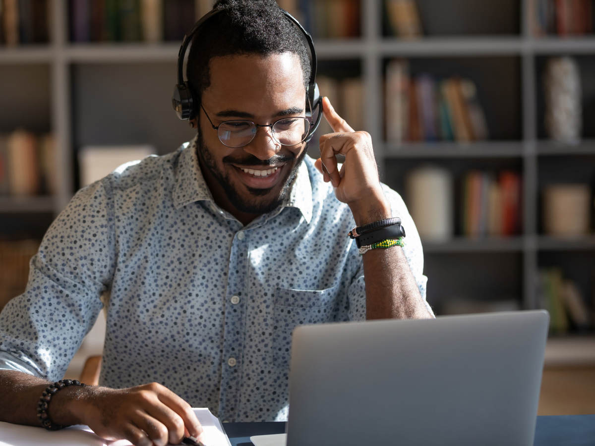 Person smiling while having an online meeting