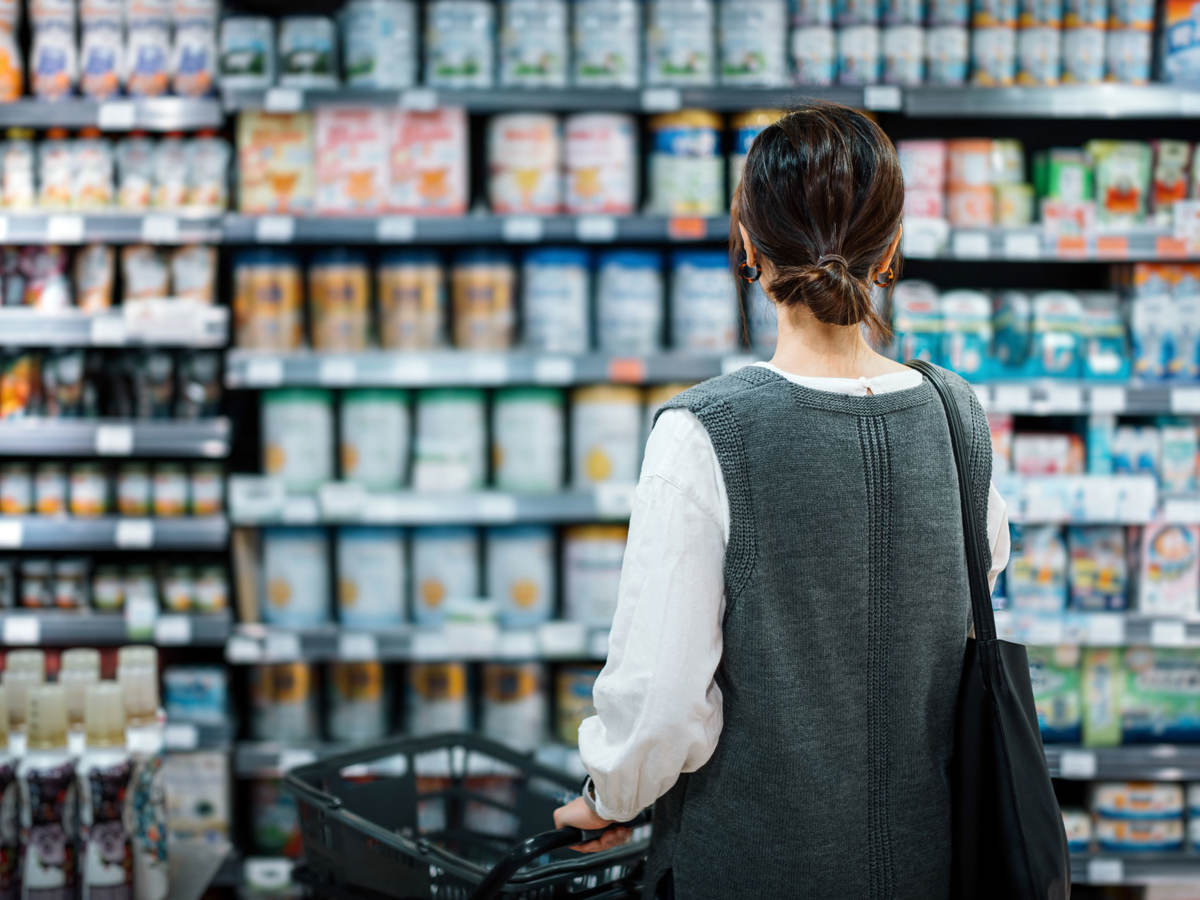 Person looking at shelves of products in a grocery store