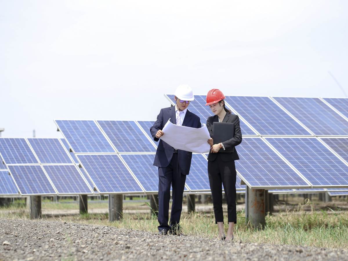 Engineers at photovoltaic power station.