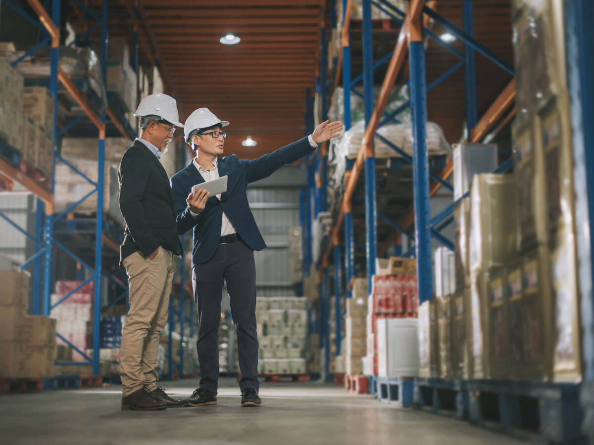 Two managers touring a warehouse