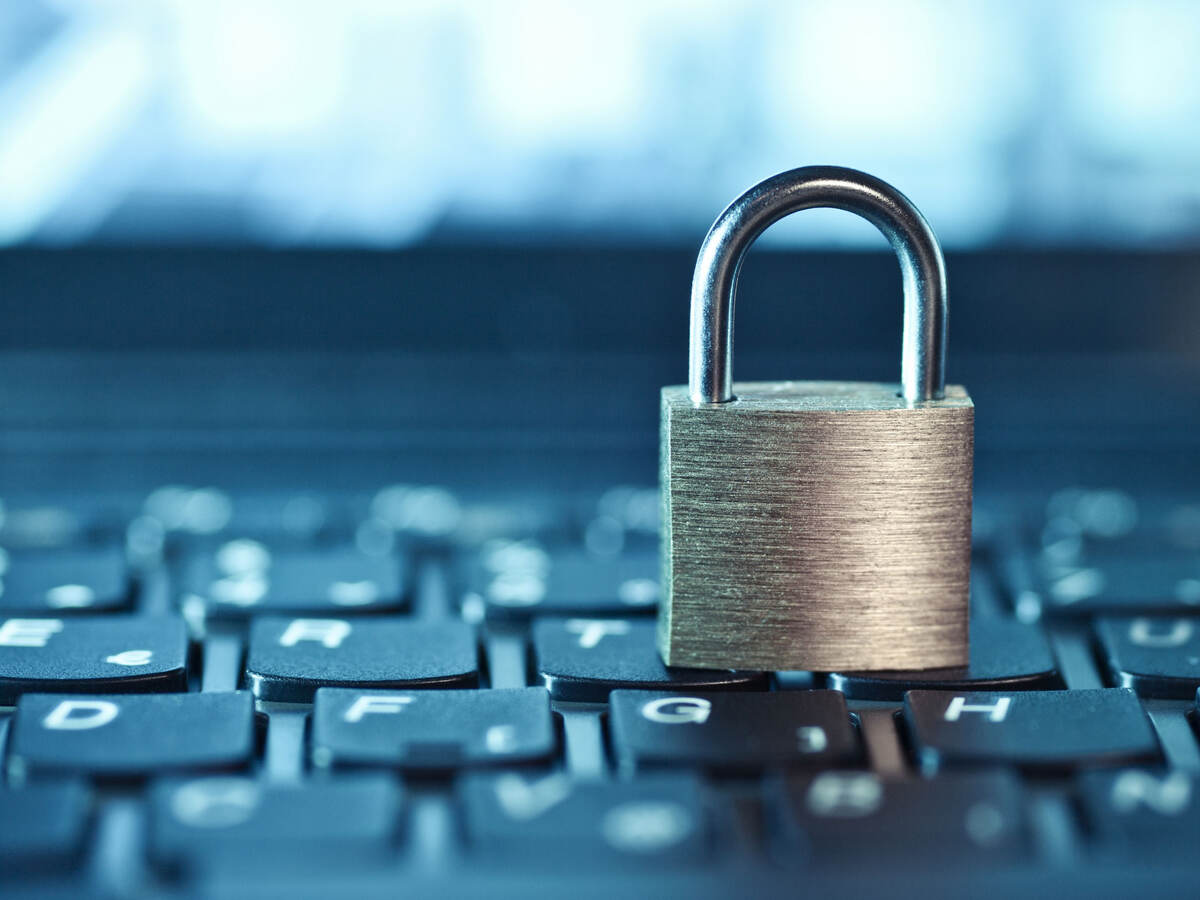 an image of a locked padlock sitting on a keyboard