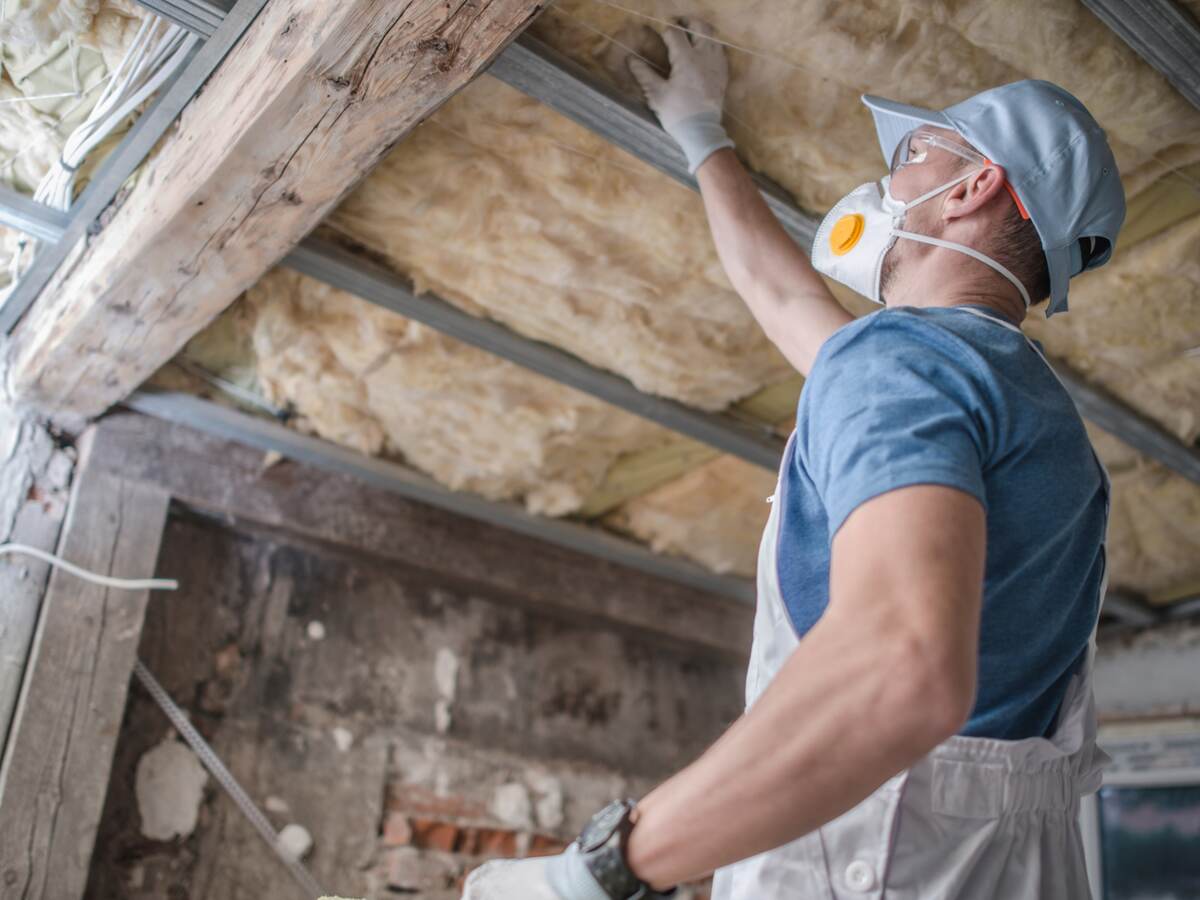 Replacing old attic mineral wool insulation.