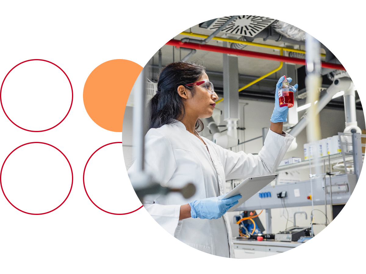 Scientist holding a flask at eye level