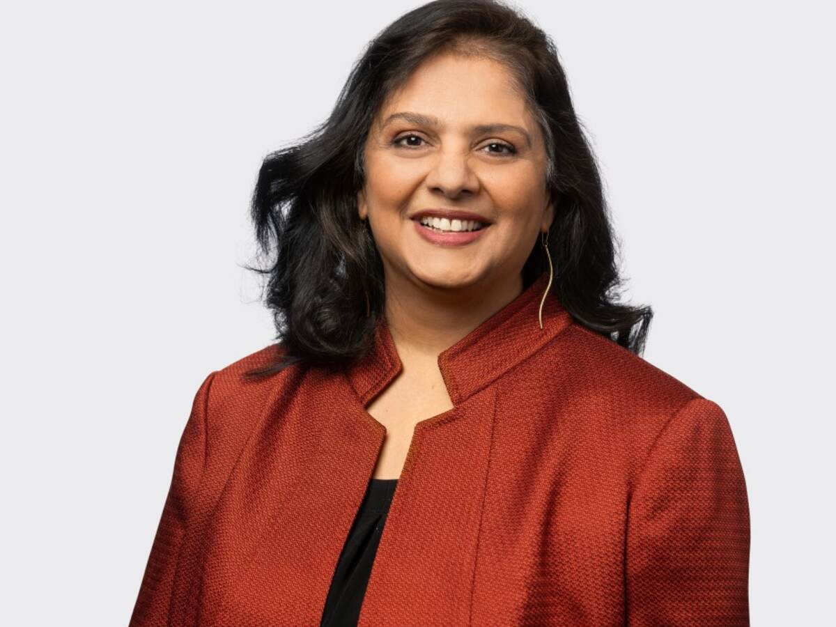 Headshot of Sreelatha Surendranathan in red jacket. 