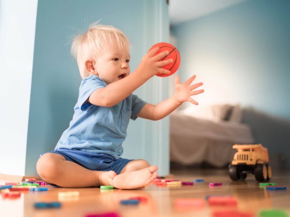 Baby boy playing with toys.