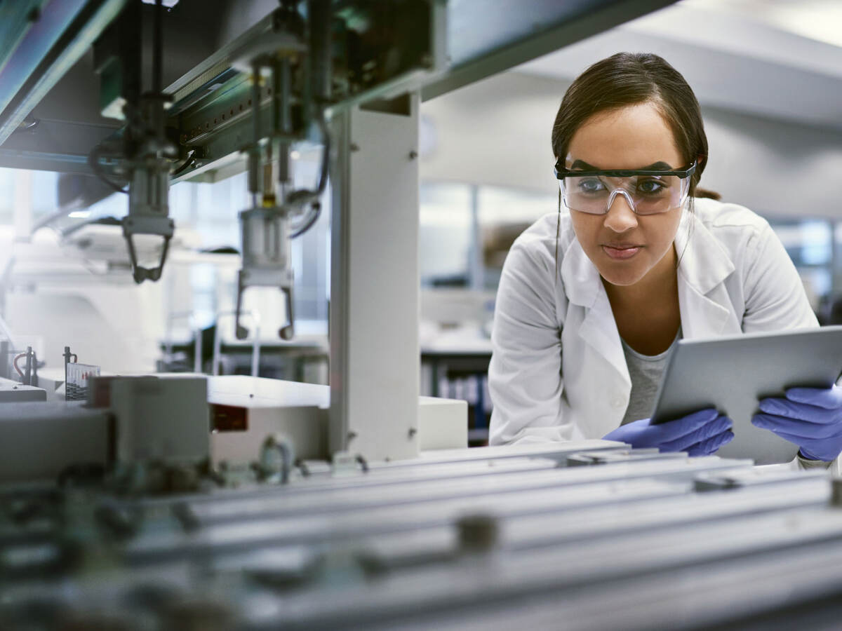 Scientist using a digital tablet while working in a laboratory