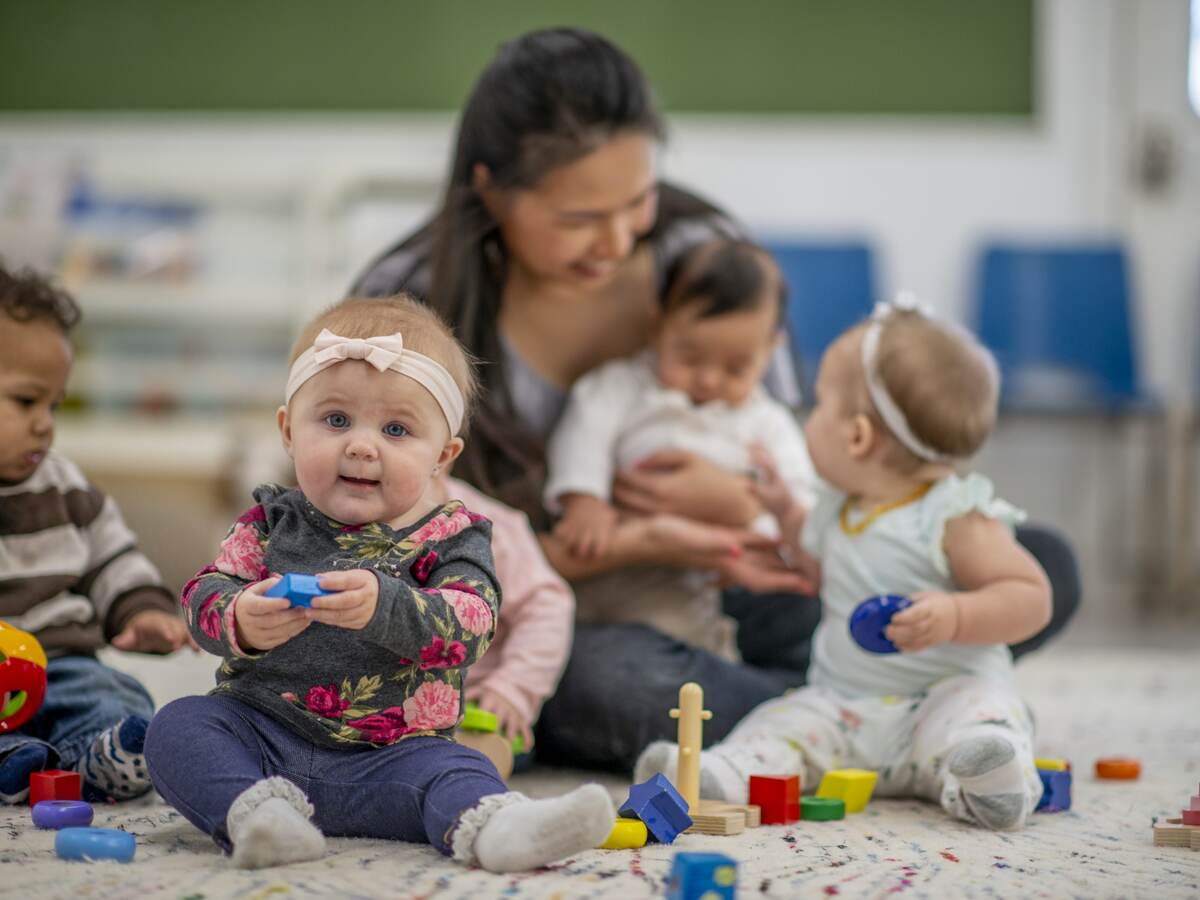 Childcare worker with babies.