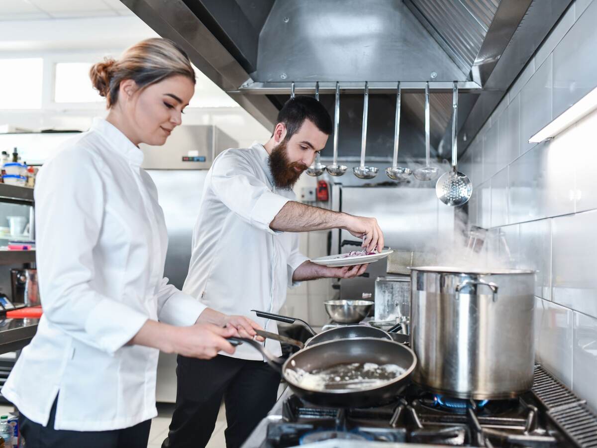 Chefs cooking in the kitchen.