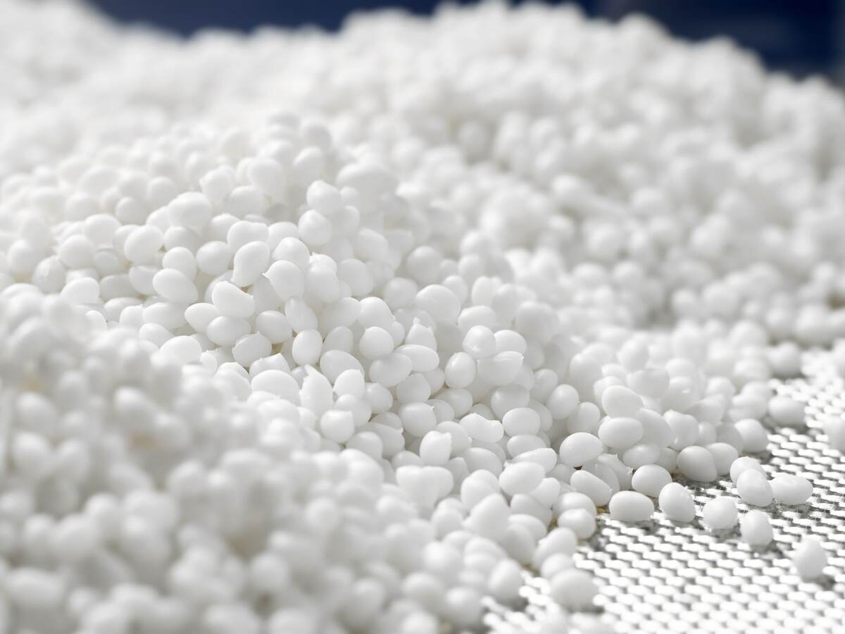 Closeup of a granule of white plastic polymer.