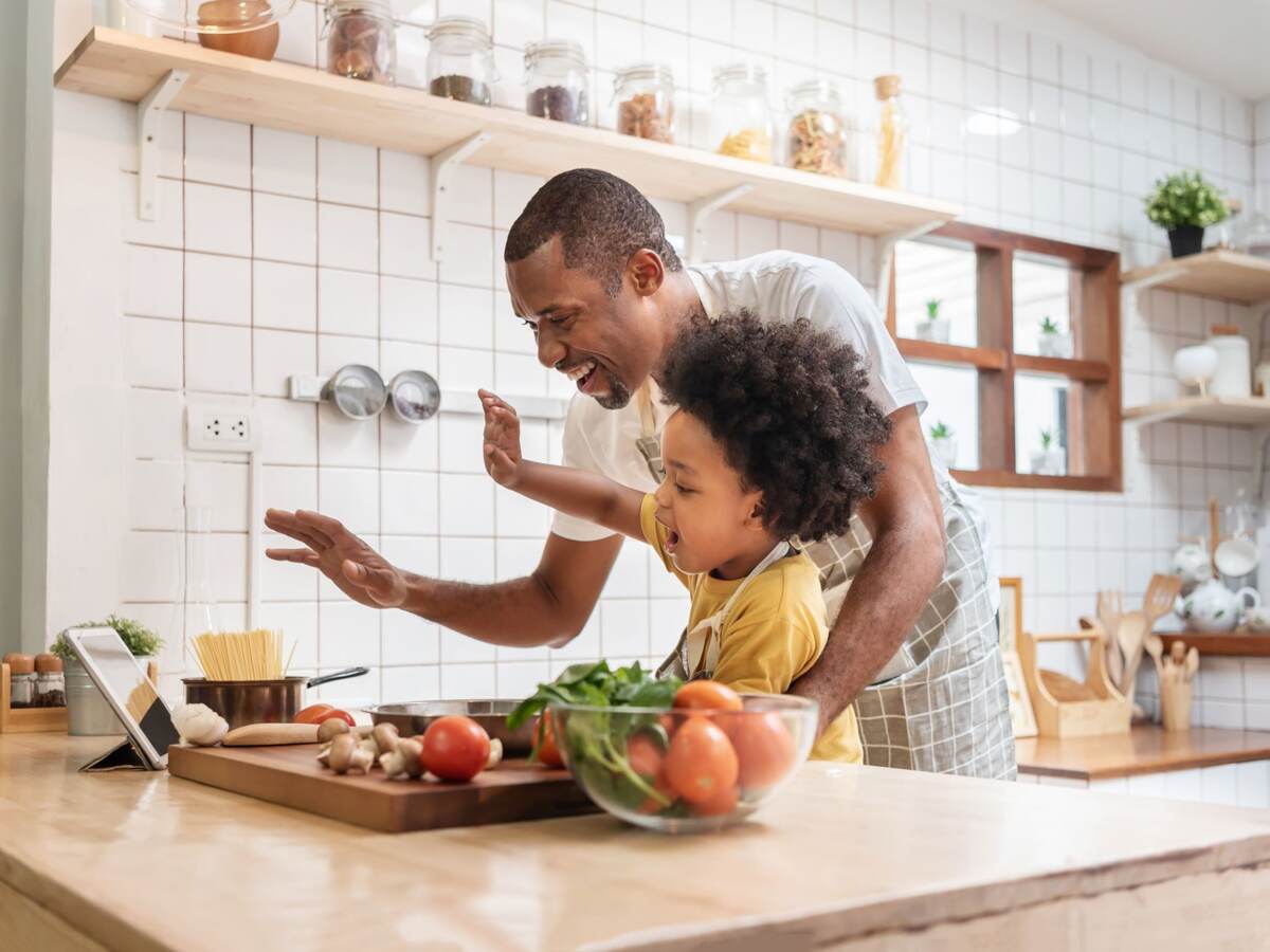 Father and son cooking.