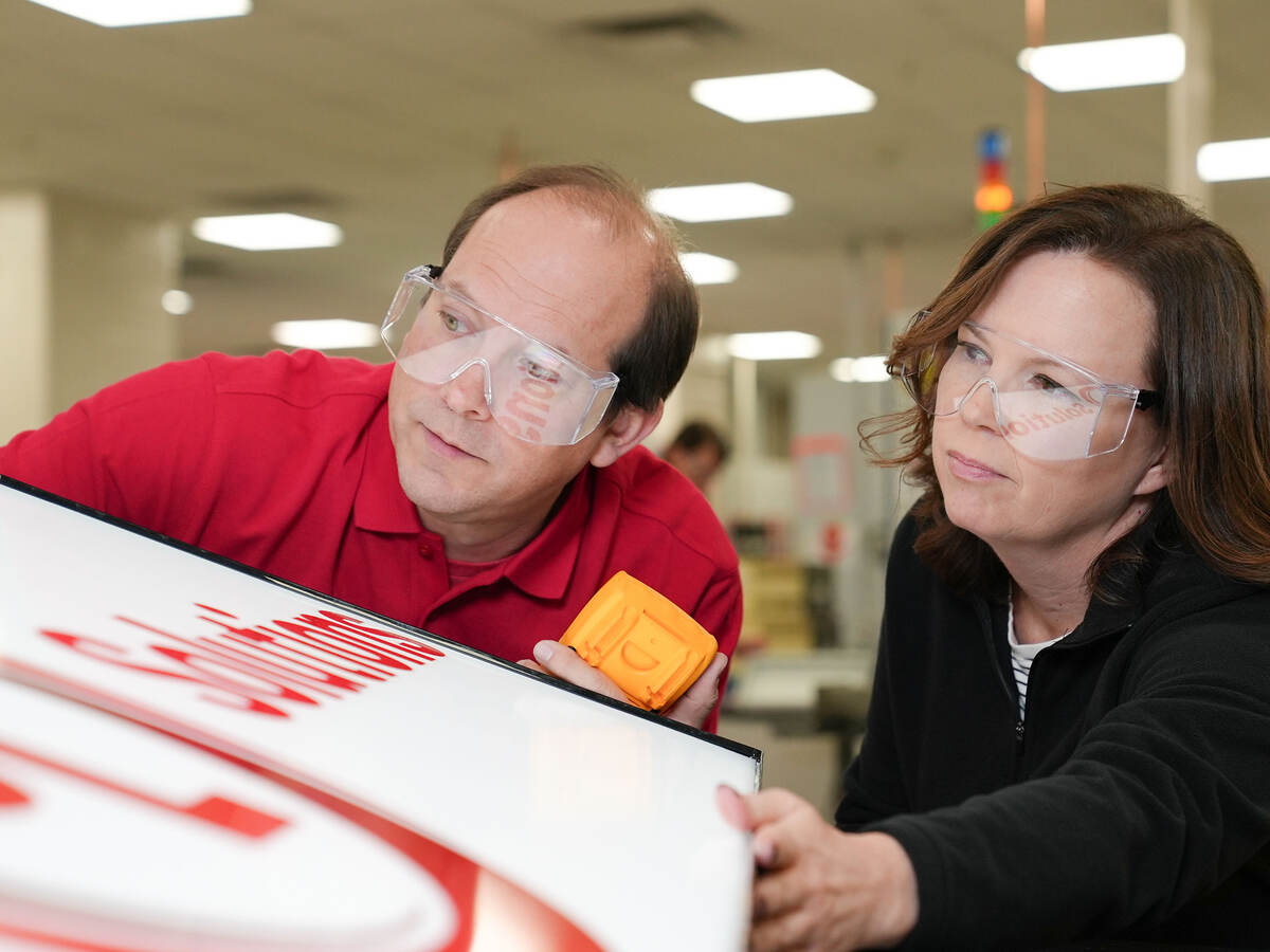 Two UL Solutions employees working together