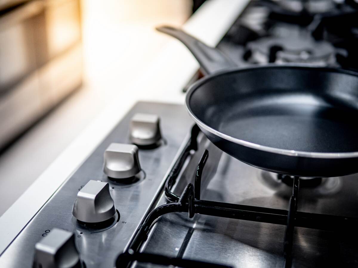 Teflon pan on stove in kitchen.