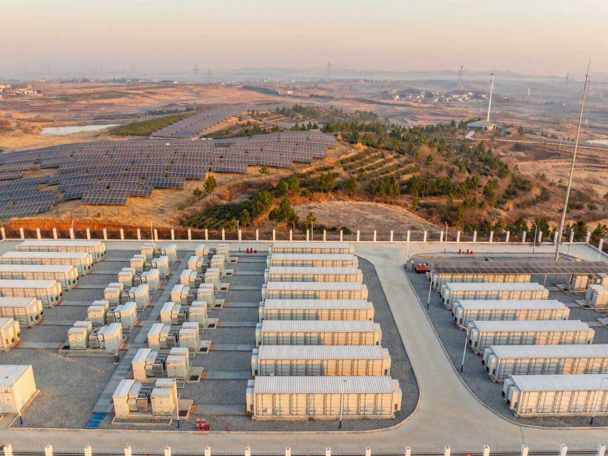 Overhead view of an energy power station next to a solar farm