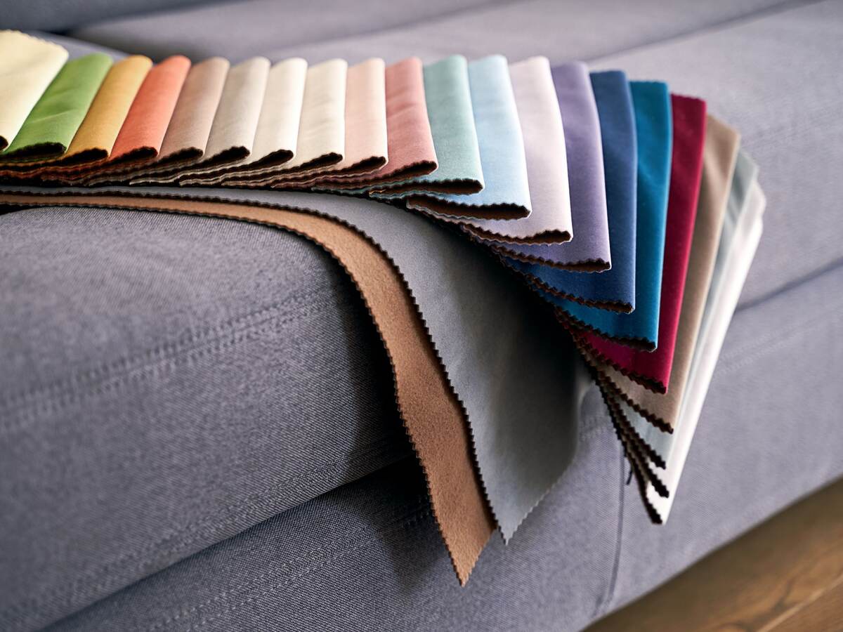 Colorful upholstery fabric samples on the home sofa