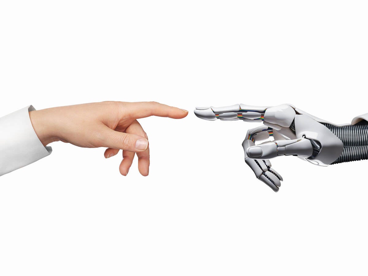 AI and human hand touching index fingers