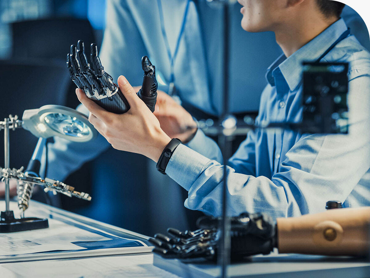 Engineer working on a robotic prosthetic arm