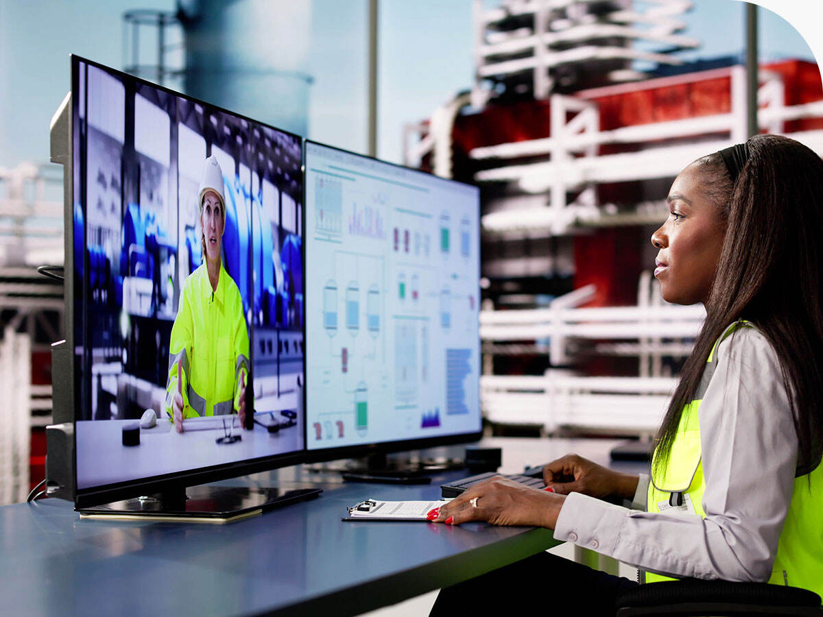 Person taking an online LMS course inside an office at a factory
