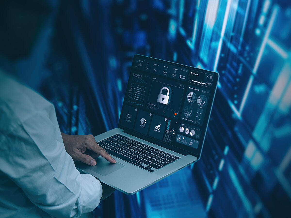 Person using a laptop to make sure their system is secure