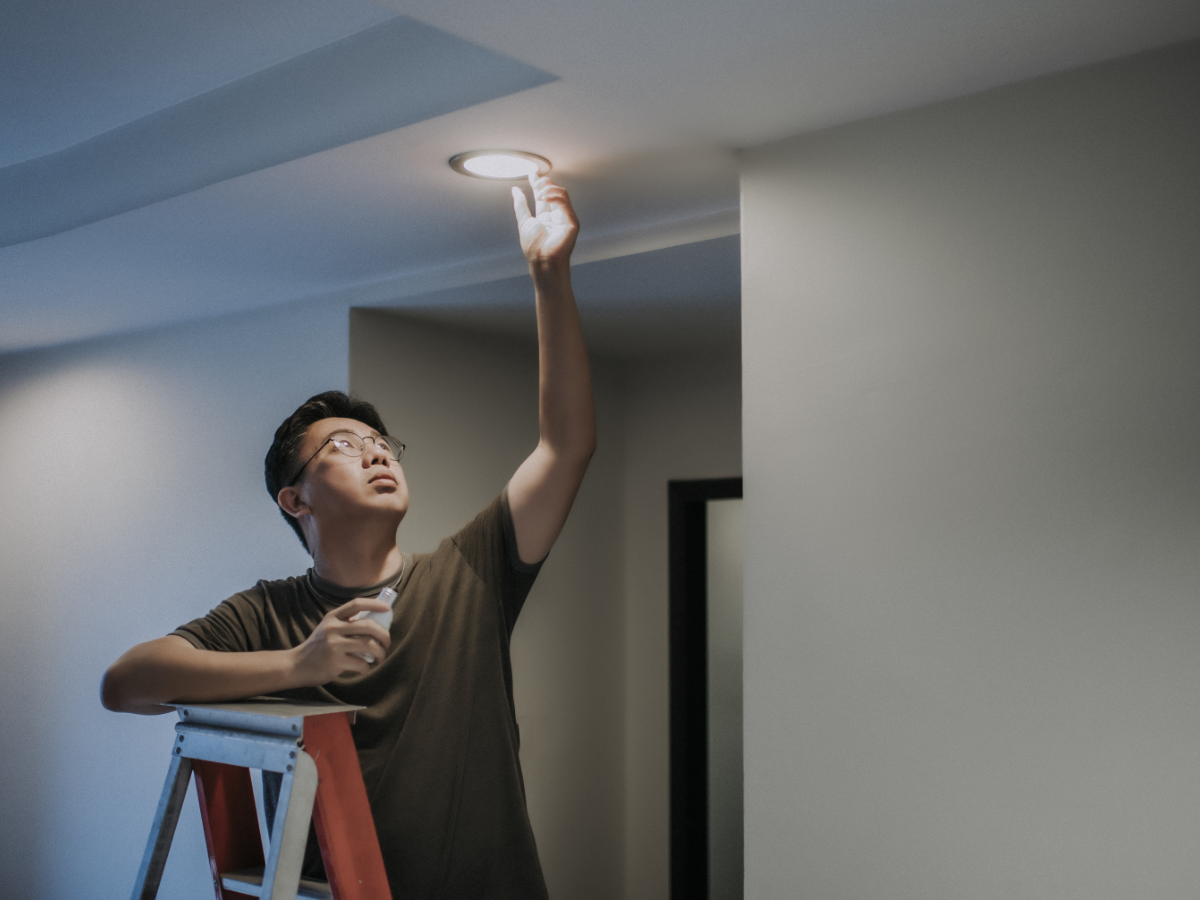 Man changing light bulb
