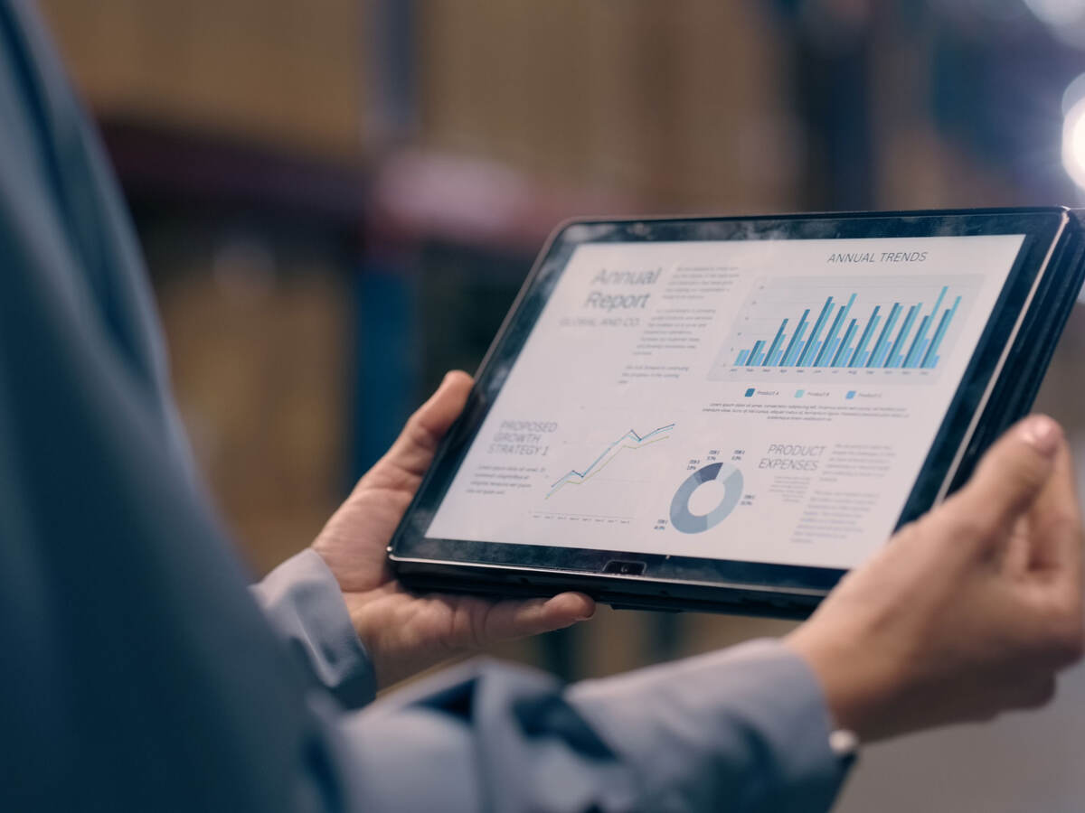 Person looking at an analytics dashboard on a tablet