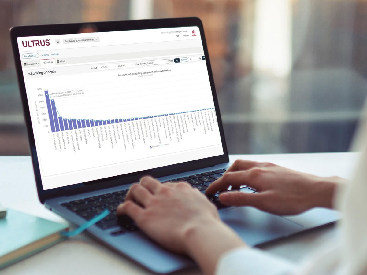 Person using ULTRUS™ Purchased Goods and Services Software module on a laptop to help determine their Scope 3 Category 1 emissions