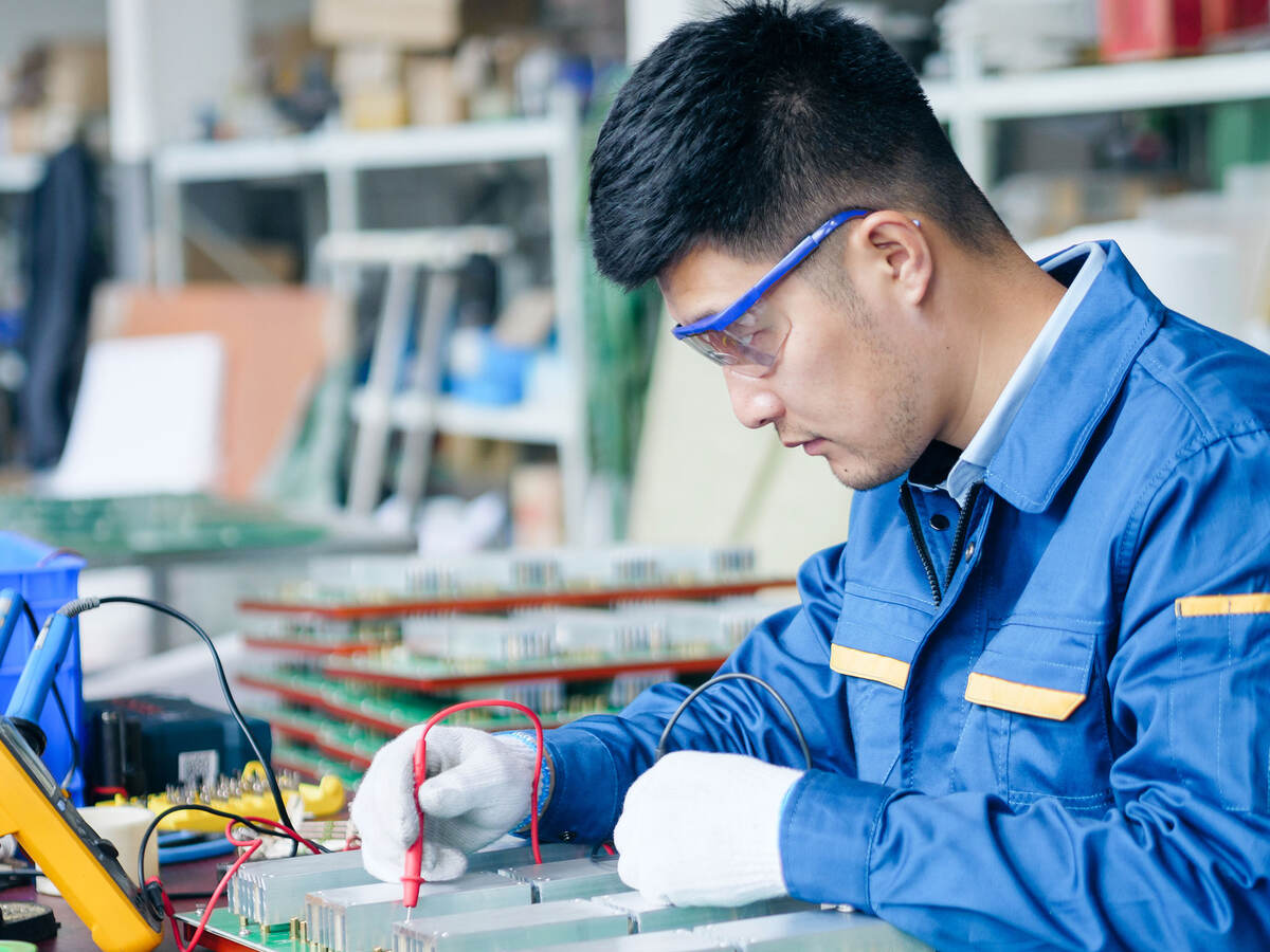 Repairman checking voltage
