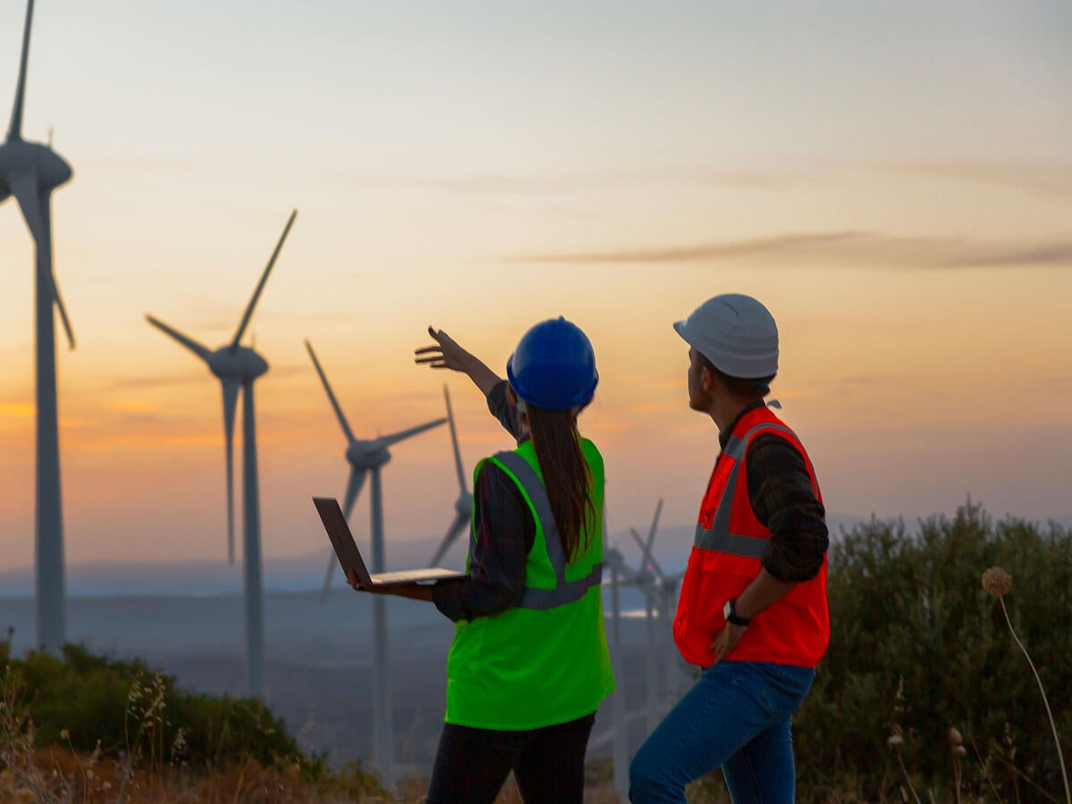 Engineers working at a wind turbine farm
