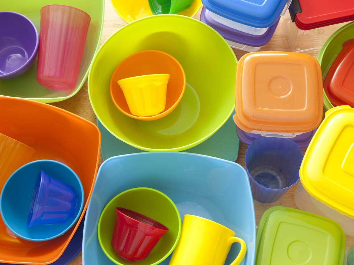 Top view of lots of plastic kitchen utensils, mostly containers