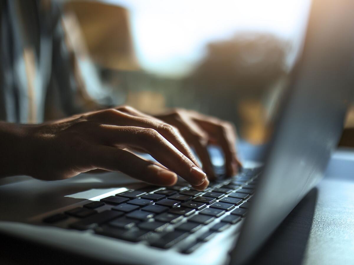 Man typing on laptop