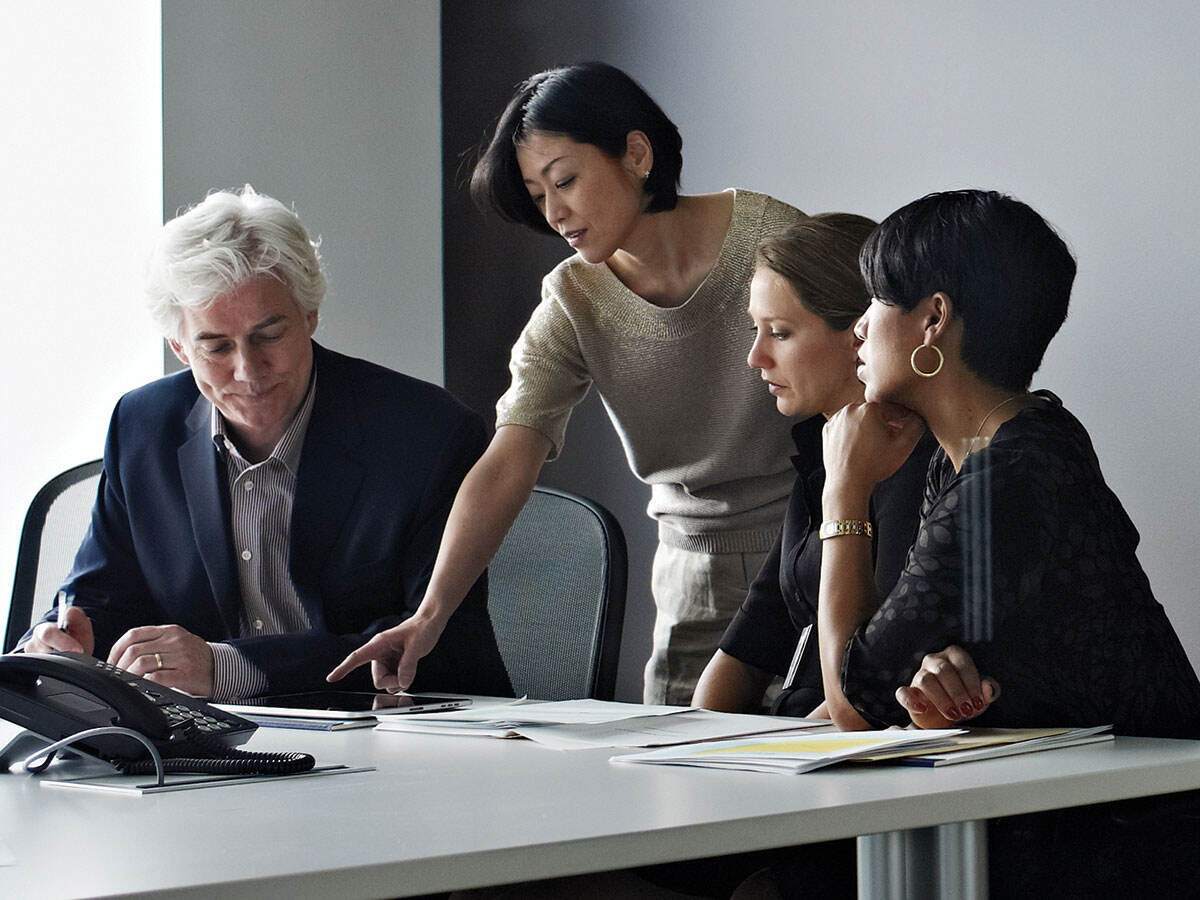 Four people working together on a project