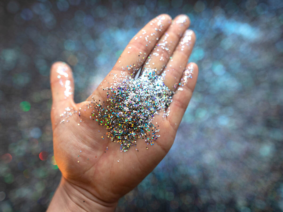 A hand with glitter in the palm