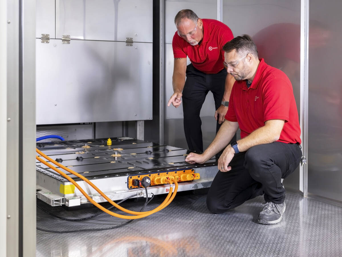 UL Solutions personnel testing an EV battery