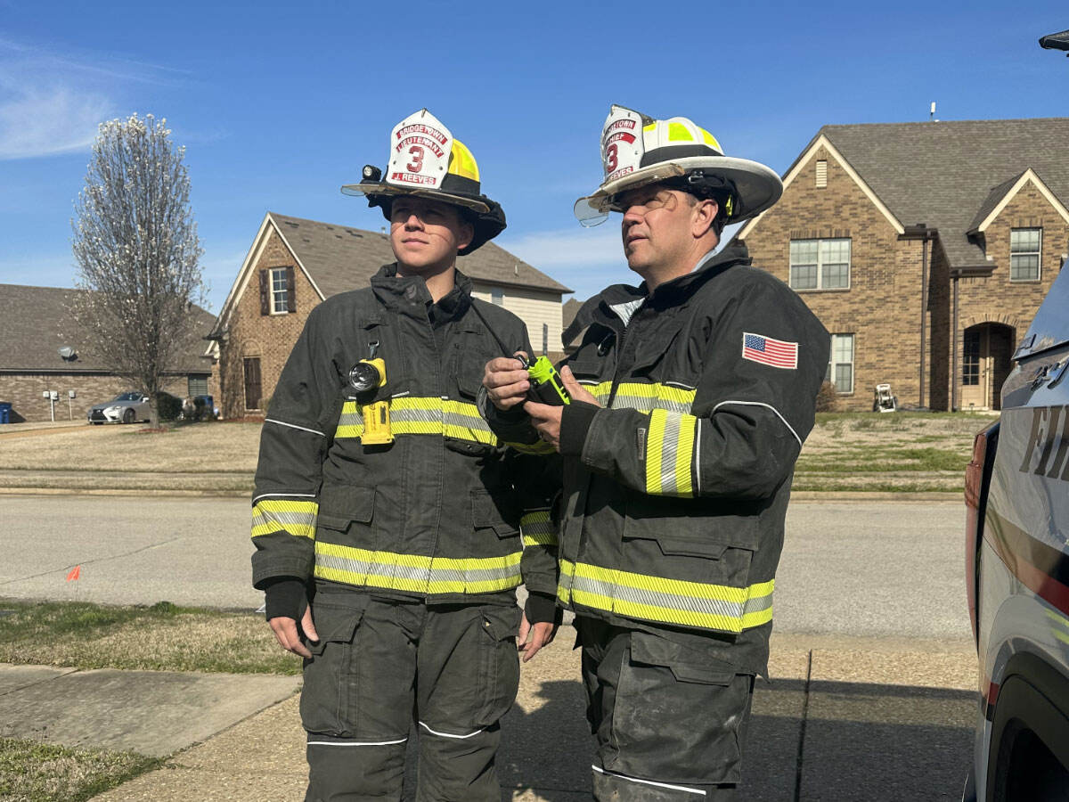 Two firefighters talking
