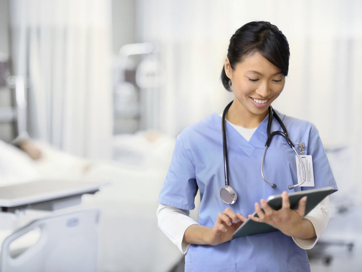 Doctor checking a chart in a hospital