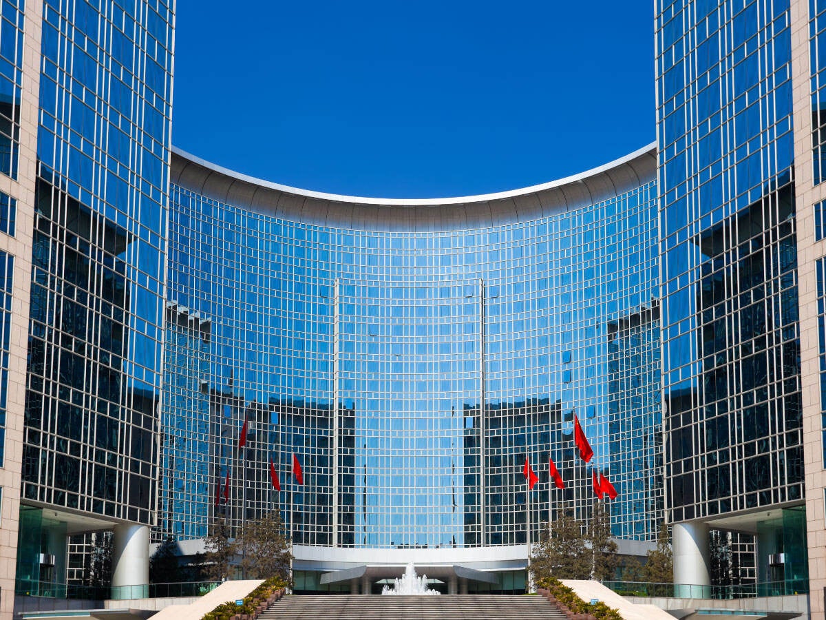 A beautiful glass building with blue sky in the background